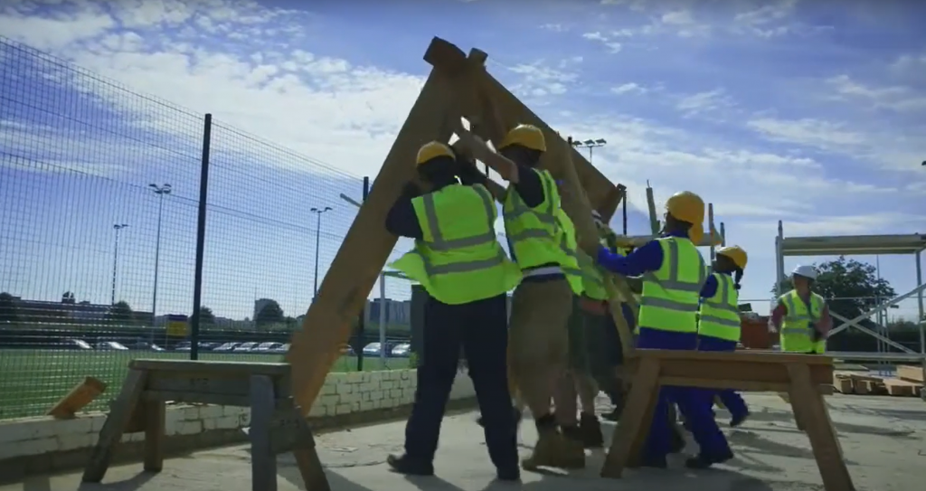 image showing children constructing the timber frame of School House project in South London